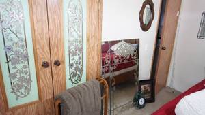 lot 101 image: Quilt Stand W Grey Quilt Draped Over It--Black Wire W Green Leaves Wall Clock--Vintage Framed & Matted Picture (Buffalo Hunters Sky By Detha Watson)--A Fine Art Print From Original Oil--Oval Mirror W Wood Frame