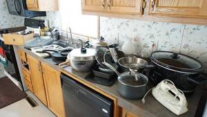lot 106 image: Pots & Pans-Strainer-Crock Pot-Rolling Pin-Baking Dishes-Utensils-Grater-Hand Mixer-Silverware In Tray