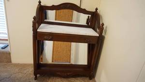 lot 115 image: Dark Wood Cabinet Or Desk W Mirrored Back---Ceramic Or Marble Top---One Drawer