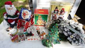 lot 75 image: Miscellaneous Christmas Items- Bows For On Christmas Gifts-Santas Red Hat-Seasons Greeting Train-Santas Sleigh-Hillside Chapel