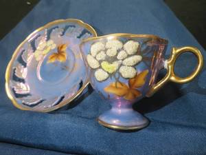 VERY RARE ANTIQUE IRIDESCENT BLUE TEACUP AND SAUCER SET.