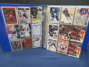 BLUE BINDER WITH COLLECTABLE CANADIAN HOCKEY CARDS AND A TON OF EMPTY EXTRA SHEETS FOR MORE CARDS