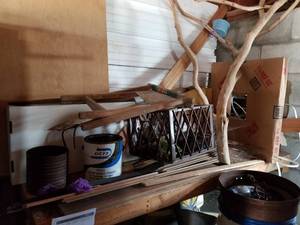 lot 725 image: Wood Boards, Plastic Crate, Decorative Wood Tree, Patio Chair and more (on corner shelf)