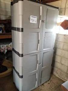 lot 723 image: Plastic Storage Cabinet 4-door 4-shelf  with Torch Lines, Safety Gear, Extension Cord with Reel, Scoop able Cat Litter, Chemicals, and more