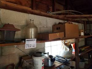 lot 712 image: Lot of Bird Feeder, Glass Jug, Grill Pan with Accessories, Wood Sculptures (on top shelf)