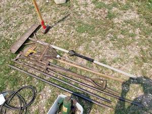 lot 775 image: Lot of (Approximately 7) Garden Tools  - Leaf Rake, Shovel, Pitch Fork, Pry Bars