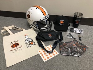 lot 14 image: Titos Vodka Football Helmet & Merch
