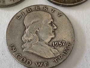 Three Benjamin Franklin Half Dollar Coins