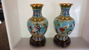 Two Hand Painted Brass Vases On Top Of Stand