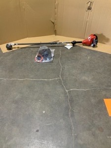 lot 12 image: Homelite 2-Cycle 26 CC Straight Shaft Gas Trimmer. See Pictures