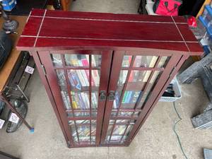 lot 121 image: Wooden 5 Shelf Storage Piece with Glass Doors filled with DVDS and More