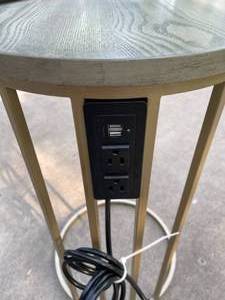 lot 191 image: Tainoki Round Metal Table w Wood Top and Outlets and USB Ports