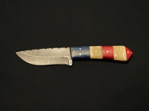 Very nice red, white and blue Damascus steel knife