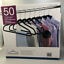 lot 63 image: New In Distressed Box. 50 Non-Slip Space-Saving Hangers M61B