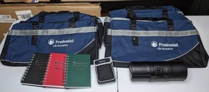 lot 342 image: Set of (6) Prudential Embroidered Bags, (3) Notebooks, Shoe Shine Kit and Binocular