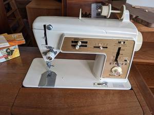 lot 90 image: Sew it All with this Singer Sewing Machine, Cabinet, Chair & Supplies
