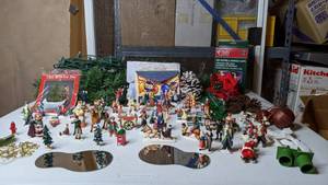 lot 283 image: Large Lot of Christmas Village Figures, Tree Removal Bag, Greeting Cards, Lights, & More