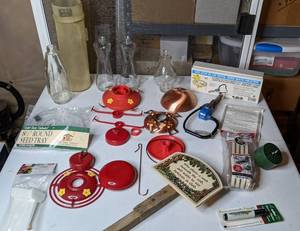 lot 215 image: Hummingbird Feeders, Bird Bath Heater, Seed Tray and More