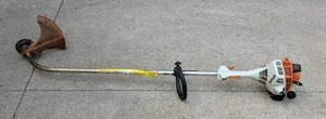 lot 11 image: Stihl Gas Powered Weed Trimmer  Wacker