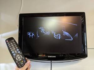 lot 15 image: 19 Samsung TV with Remote and Wall Mount
