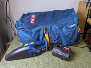 lot 259 image: Ryobi Duffel Bag w Vintage Ryobi Cordless Vacuum & 18V Charger
