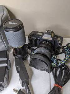 lot 102 image: Lot of Three Cameras Canon T70, Nikon Zoom Touch 400, Nikon Cool Pix S710