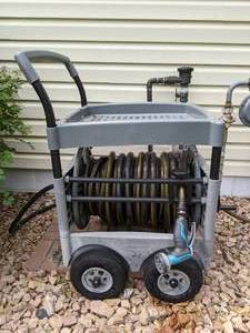 lot 332 image: Suncast Hose Reel Cart w 2 Hoses and Sprayer