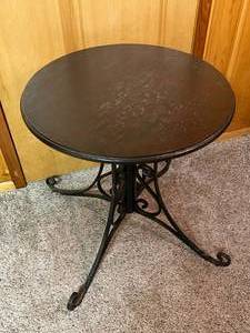lot 102 image: Round Wood Table With Ornate Metal Base