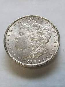 lot 06 image: 1886 MORGAN SILVER DOLLAR UNC
