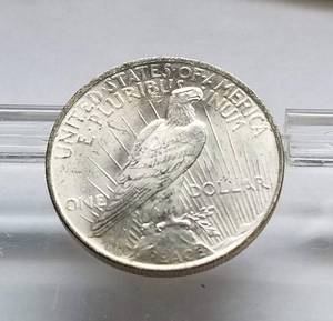 lot 32 image: 1923 PEACE SILVER DOLLAR BU-UNC looks better in hand than in pics