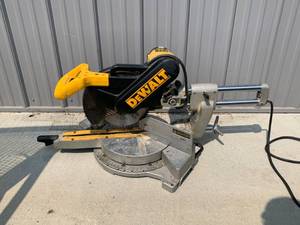 lot 1 image: Dewalt DW708 12 Sliding Compound Miter Saw (used one sold for $300 on Ebay)