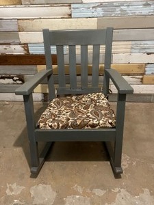 Rocking chair with cushions and ottoman