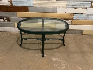 Oval cast table with glass top