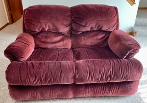 lot 181 image: Lovely Reclining Burgundy Soft and Comfortable Upholstered  Loveseat