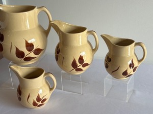 lot 63 image: Four Vintage Watt Ware Pitchers