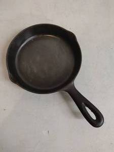lot 33 image: Cast Iron Sauce Pan