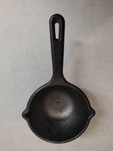 lot 35 image: Cast Iron Sauce Pan