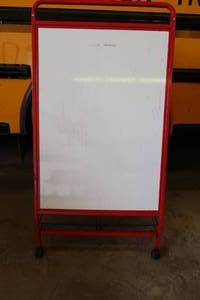 ROLLING METAL EASEL WITH WHITE ERASE BOARD.