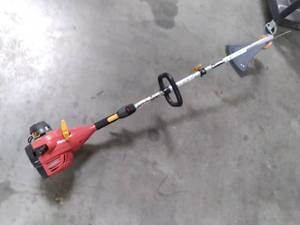 lot 251 image: Weed whip, has compression may need carb cleaned