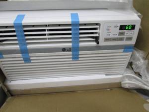 LG room air conditioner, powers on,...