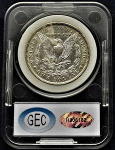 lot 853 image: 1887 O Morgan Silver Dollar - MS 67, CEG grading, H 606 182,GEM Uncirculated. Note  Internal label omits O.