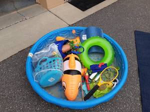 lot 24 image: Kiddie Pool, Inflatables, Water Balloon Launcher, Lightning McQueen Fishing Pole & Lots Of Fun Other Toys