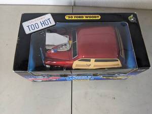 lot 204 image: Muscle Machines Red 50 Ford Woody Collectible Car
