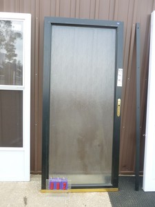 lot 2 image: Lowes 36 display storm door. Aluminum frame. Acrylic window. As shown.