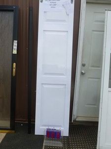 lot 4 image: PVC split barn door. 2 panel. 42 x 84. White. Pt number8604284100. Includes rail but no hardware. Retails for $400.00. As shown.