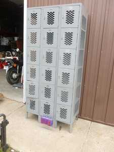 lot 6 image: 18 compartment steel locker. Roughly 1 squares. Good condition. As shown.