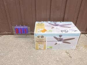 lot 11 image: Carolton Hampton Bay ceiling fan. Box is damaged. Appears new & complete. As shown.