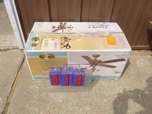 lot 14 image: Hampton Bay ceiling fan. New condition but is missing blades & blade brackets. As shown.