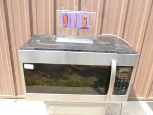 lot 16 image: Samsung under counter microwave. Approximately 2 years old. Lightly used. Could use a good cleaning. Tested & works. As shown.