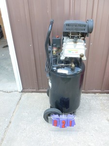 lot 21 image: Brute 15 gal 125 psi upright air compressor. Used condition. Tested & works. As shown.